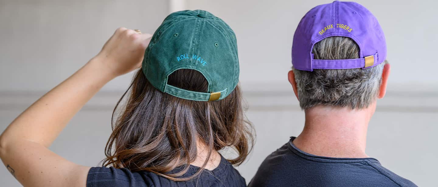 Man hanging showing back of hat.